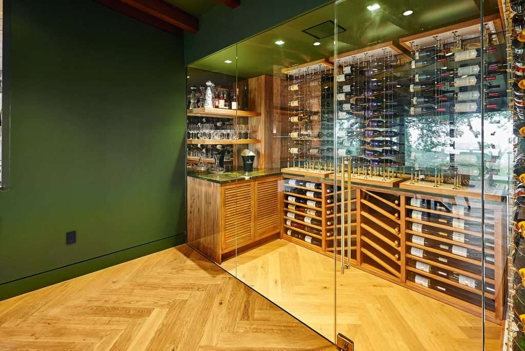 Custom glass wine cellar built by Bijou Builds in Westlake, Austin TX